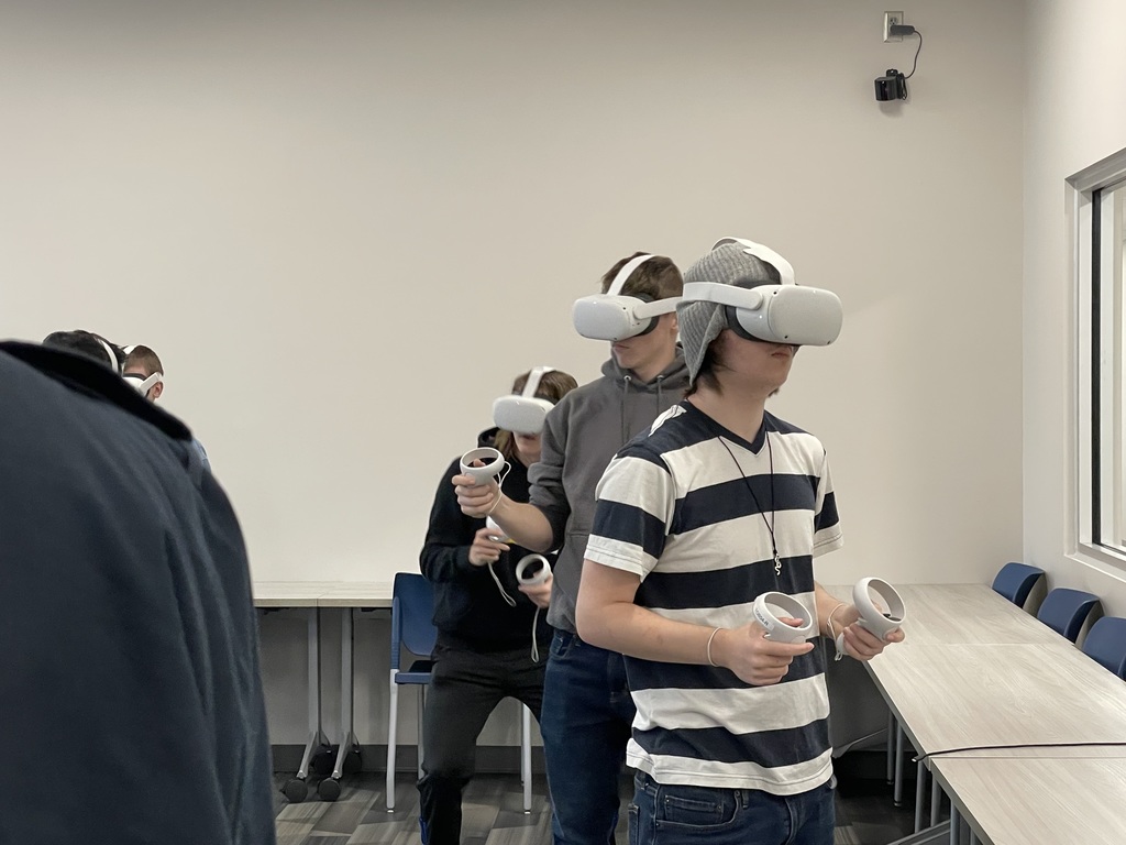 Students wearing virtual reality headsets 