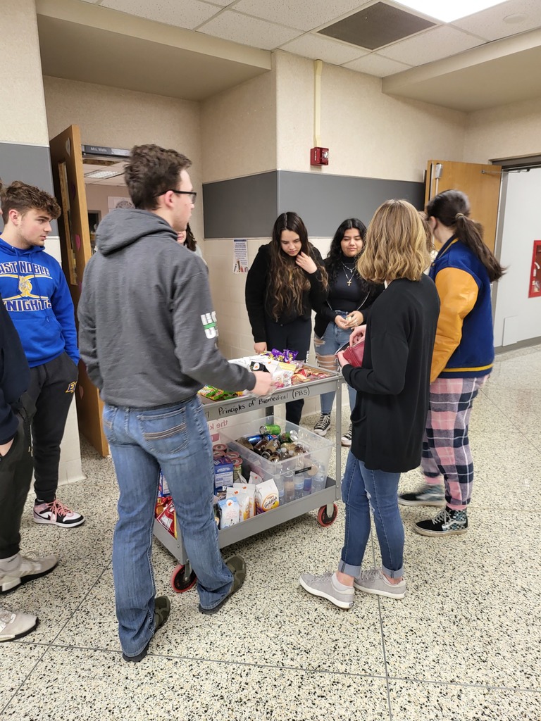 students buying snacks from a wagon