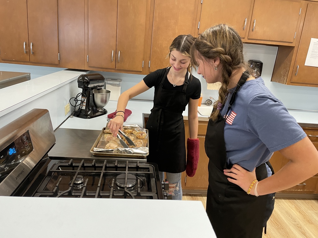 students cooking in a classroom cooking lab